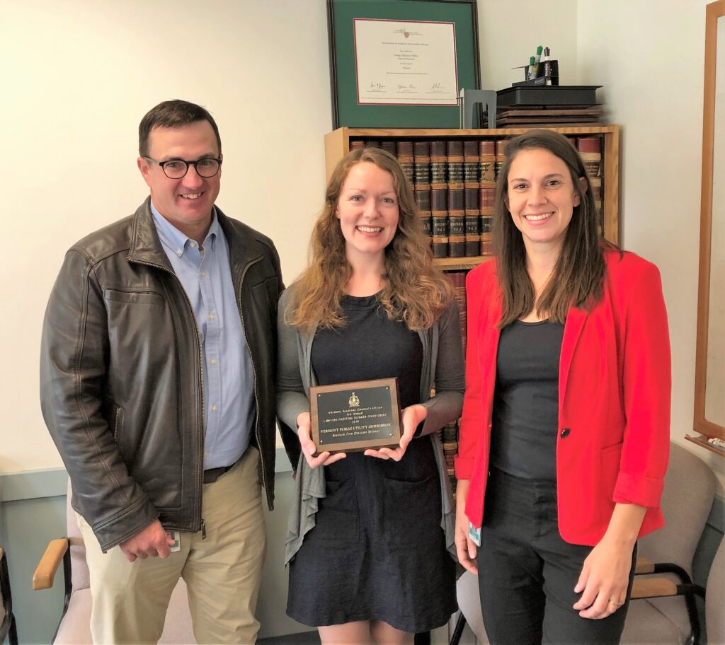 Rob McDougall, Chief of the Environmental Division, presents Lawyers Fighting Hunger "friendly competition" award to representatives of Downs Rachlin Martin PLLC, winner of the large firm division.