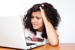 Frustrated student looking at a computer