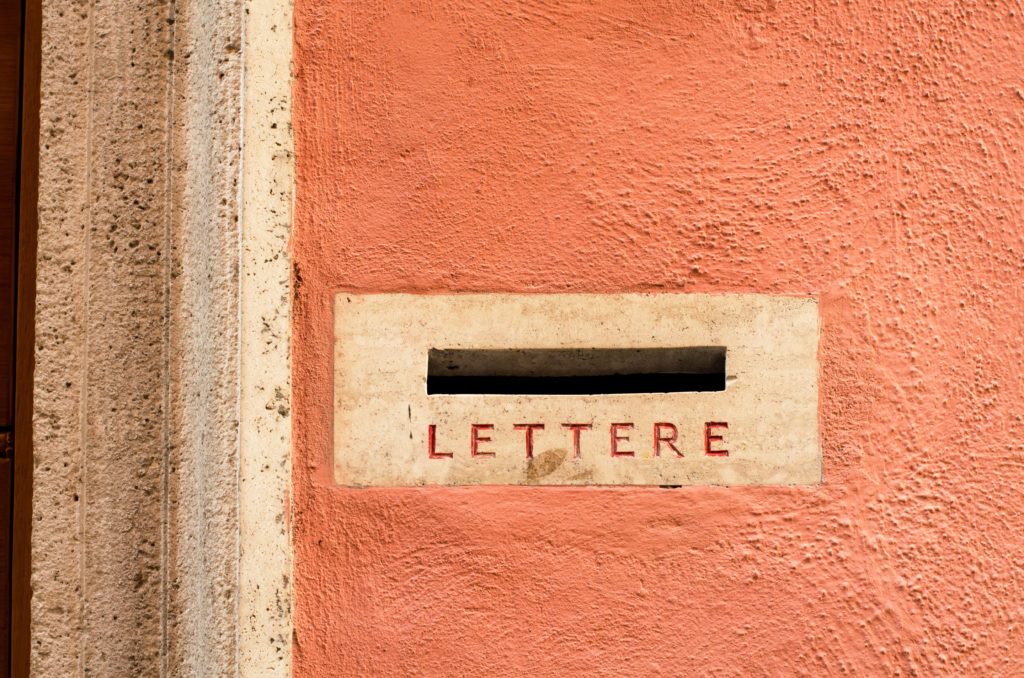 Black letter slot in tan door