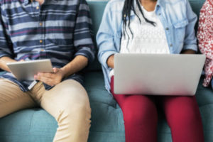 Two people using electronic devices 