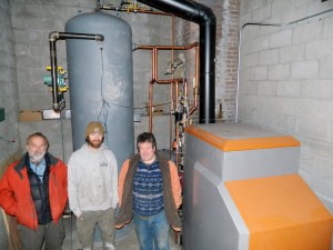 Rob Steingress (VFFC), Bill Kretzer (12 Gauge Electric) and Greg Cox (VFFC) perform final inspections before the initial firing of the boiler.
