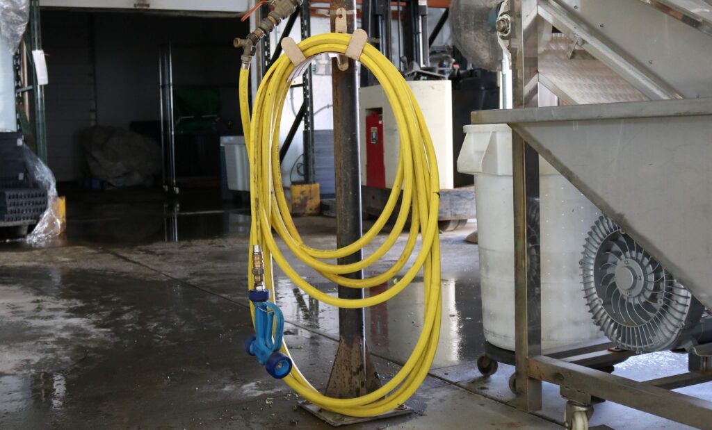 Another approach to hanging a hose reel. - The SawdustZone