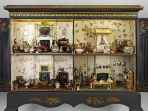 Photograph of the "Killer Cabinet" an example of an early doll house. This doll house is located at the Victoria and Albert Museum in London.