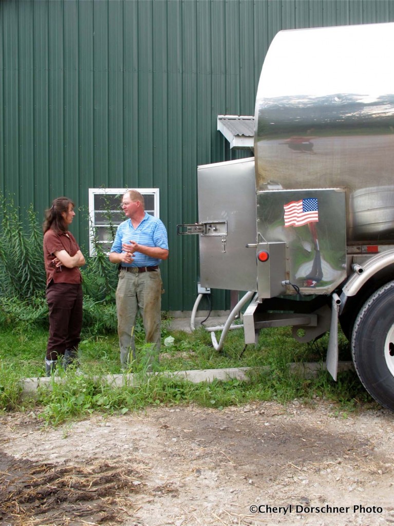 Dr. Julie Smith talks with Butterwick Farms owner/operator John Roberts about the her grant-funded project, "Costs and Challenges Associated with Developing and Implementing a Community-Wide Biosecurity Plan."  Photo by Cheryl Dorschner