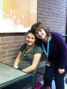 Leah and Taylor pose for a photo in The Marche dining hall