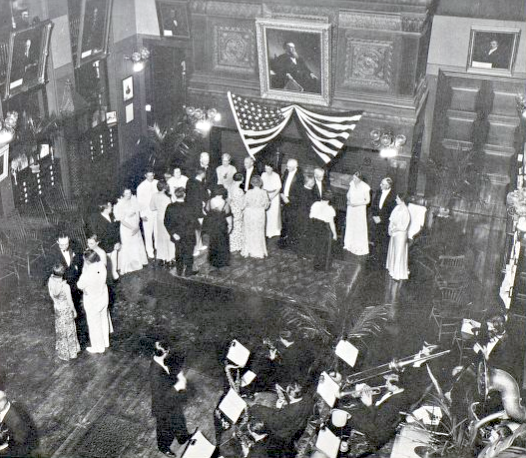 1936 reception in Billings Library with receiving line in front of the fireplace and an orchestra