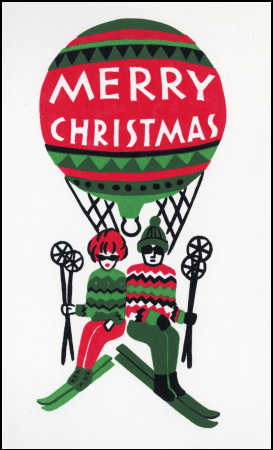 Christmas card featuring a man and woman wearing skis and holding ski poles being lifted by a hot air balloon decorated like a Christmas ornament reading "Merry Christmas."