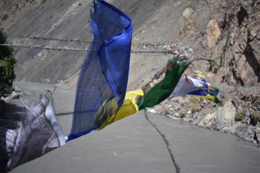 Image of prayer flags flying over the Kali Gandaki river
