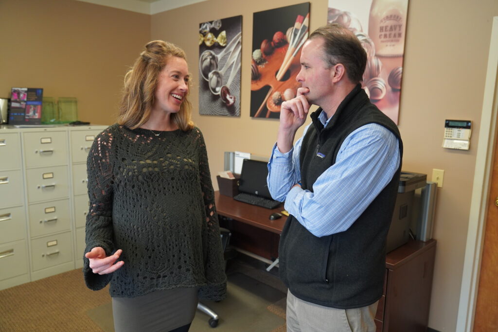 Julia Birnn Fields speaking with Attorney General T.J. Donovan at Birnn Chocolates of Vermont