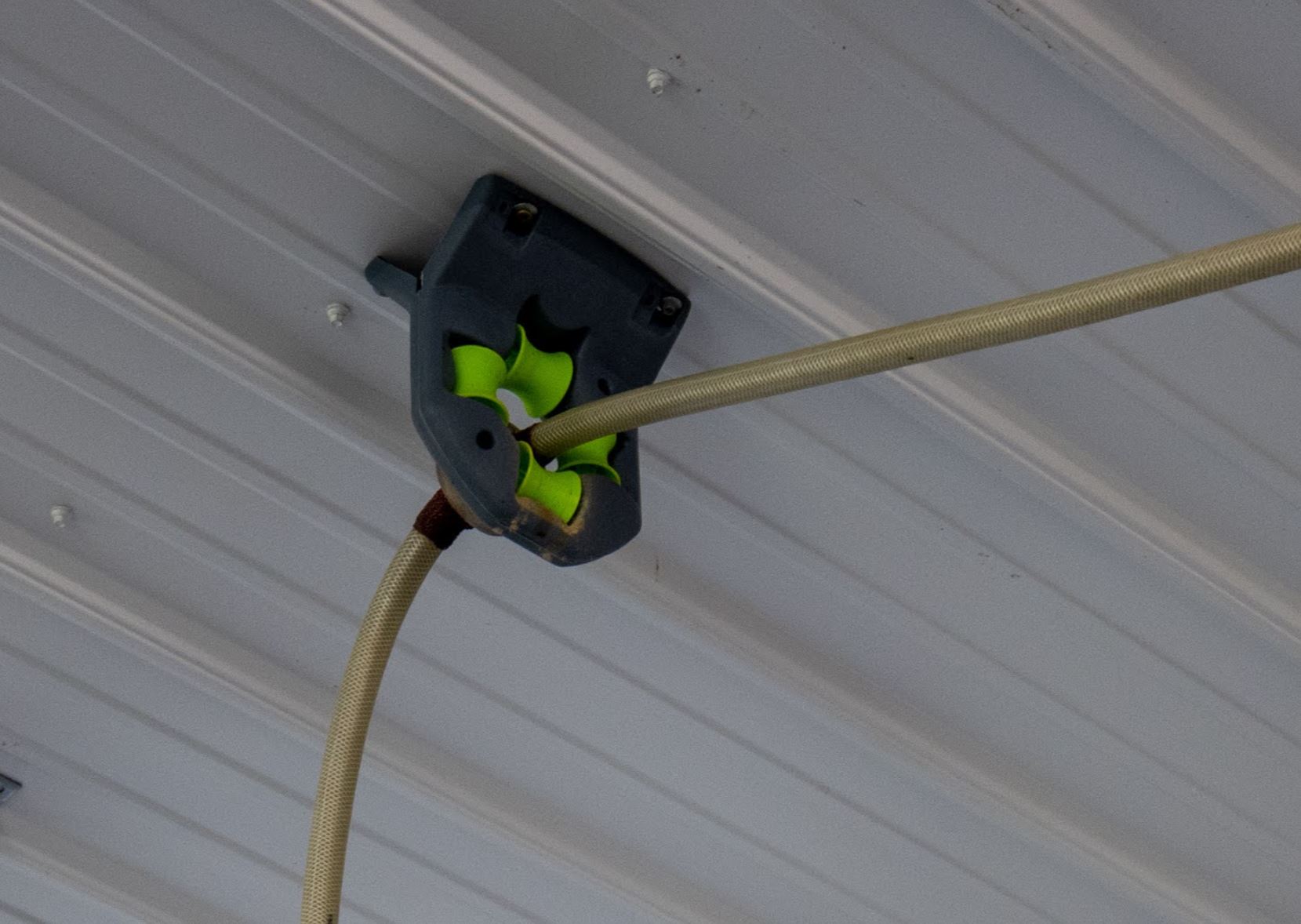 Another approach to hanging a hose reel. - The SawdustZone