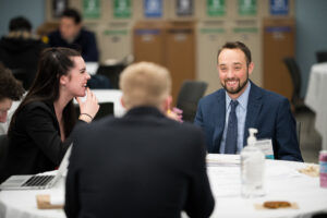 Photo of Grossman students networking at an event.